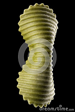 Macro photo of green farfalle pasta isolated on black with clipping path Stock Photo