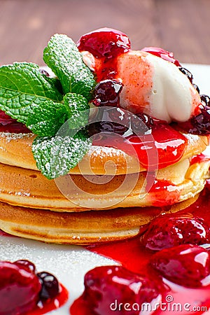 Macro photo of pancakes with strawberry and black currant Stock Photo