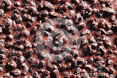 Macro photo of red rough sandpaper on wood. Red texture. Stock Photo