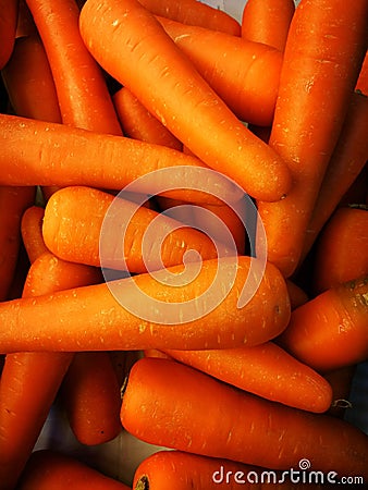 Macro photo spring food vegtable carrot. Texture background of fresh large orange carrots. Product image vegetable root carrot. Stock Photo