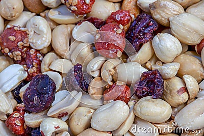 Macro photography of a heap of mixed nuts and cranberries Stock Photo