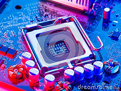 Macro photography of a processor, microprocessor with pins up on a computer motherboard. Neon lighting. Technological background. Stock Photo
