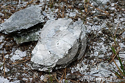 Macro photography of unprocessed pieces of mica minerals in a natural deposit Stock Photo