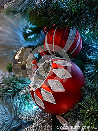 Pine cones, snowflakes, peppermints, and other ornaments decorating a Christmas tree for the holiday Stock Photo