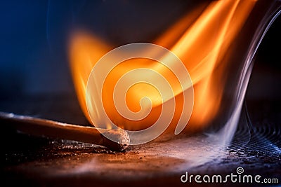 Macro shooting of a burning match with a flame Stock Photo