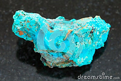 raw Chrysocolla stone on dark background Stock Photo