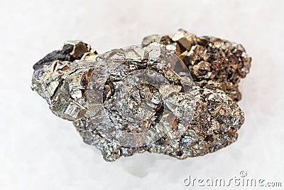 raw pyrite stone on white marble Stock Photo