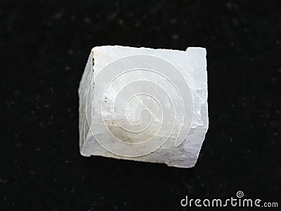 rough white calcite stone on dark background Stock Photo