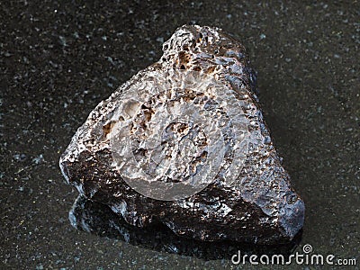 Rough Hematite stone on black Stock Photo