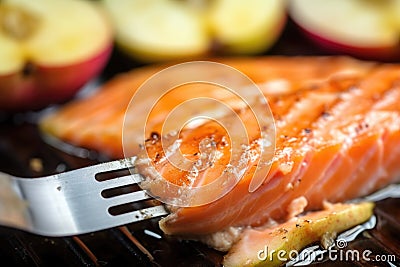 macro shot of apple cider bbq salmon texture on fork Stock Photo