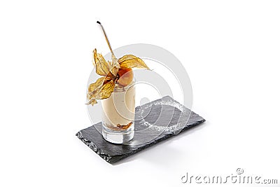 Macro Shot of Cheesecake in High Glass Decorated with Physalis Stock Photo