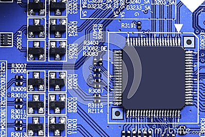 Macro shot of a Circuitboard with resistors microchips and electronic components. Computer hardware technology. Integrated communi Stock Photo