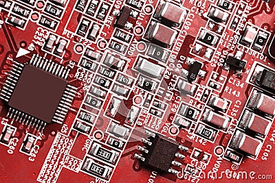 Macro shot of a Circuitboard with resistors microchips and electronic components. Computer hardware technology. Integrated communi Stock Photo