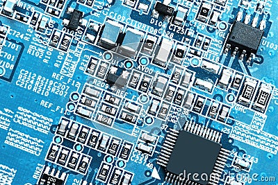 Macro shot of a Circuitboard with resistors microchips and electronic components. Computer hardware technology. Integrated communi Stock Photo