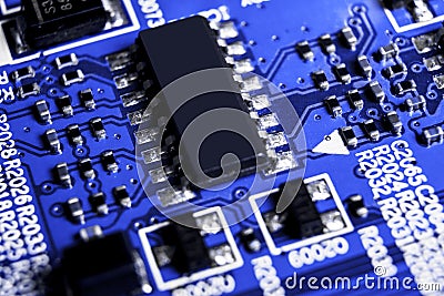 Macro shot of a Circuitboard with resistors microchips and electronic components. Computer hardware technology. Integrated communi Stock Photo