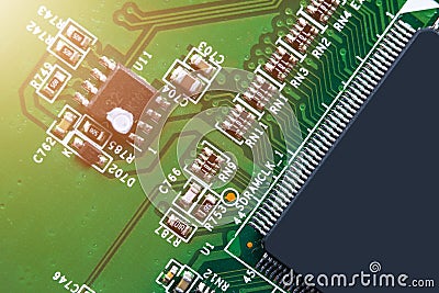 Macro shot of a Circuitboard with resistors microchips and electronic components. Computer hardware technology. Integrated communi Stock Photo