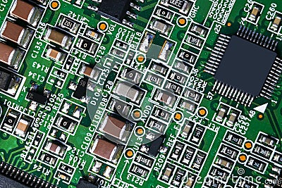 Macro shot of a Circuitboard with resistors microchips and electronic components. Computer hardware technology. Integrated communi Stock Photo