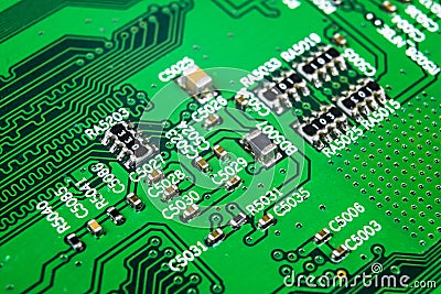 Macro shot of a Circuitboard with resistors microchips and electronic components. Computer hardware technology. Integrated communi Stock Photo