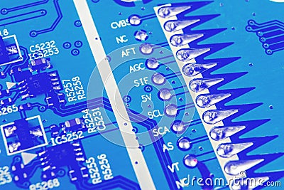 Macro shot of a Circuitboard with resistors microchips and electronic components. Computer hardware technology. Integrated communi Stock Photo