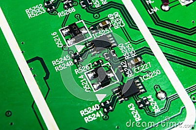 Macro shot of a Circuitboard with resistors microchips and electronic components. Computer hardware technology. Integrated communi Stock Photo