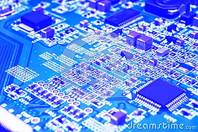 Macro shot of a Circuitboard with resistors microchips and electronic components. Computer hardware technology. Integrated communi Stock Photo