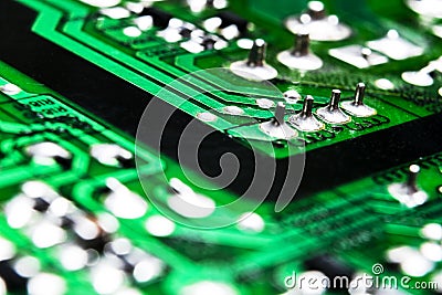 Macro shot of a Circuitboard with resistors microchips and electronic components. Computer hardware technology. Integrated communi Stock Photo