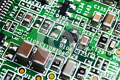 Macro shot of a Circuitboard with resistors microchips and electronic components. Computer hardware technology. Integrated communi Stock Photo