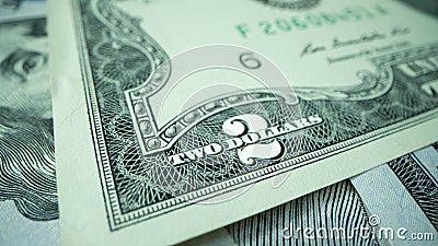 Macro shot of dollars. Stack of two dollars bills close-up. Stock Photo