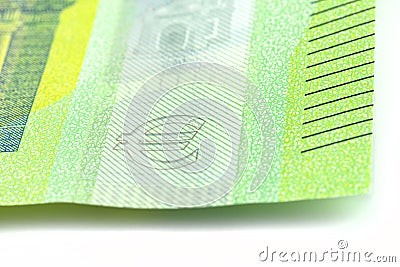 Macro shot of a European Union banknote of 100 EUR, close-up on the symbol of EURO, selective focus. Stock Photo