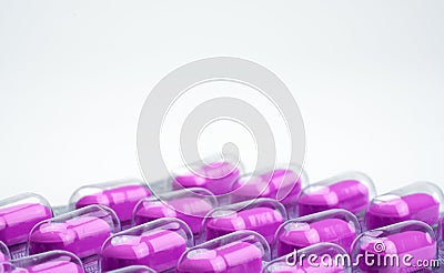 Macro shot of purple caplets pills in blister pack on white background. Mild to moderate pain management. Pain killer medicine. Stock Photo