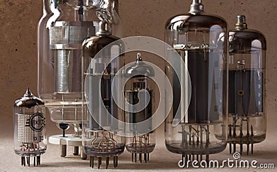 Macro shot of vintage radio lamps on kraft paper background. Stock Photo