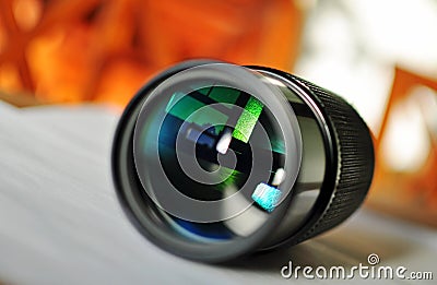 Macro of a slr camera zoom lens reflecting window Stock Photo