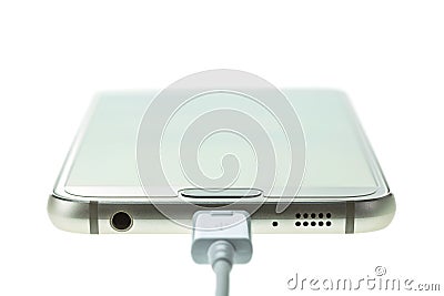 Macro Smartphone connect with charger isolated on white Stock Photo