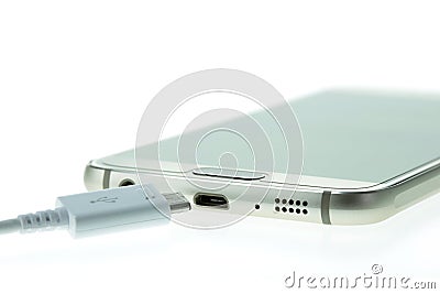 Macro Smartphone connect with charger isolated on white Stock Photo