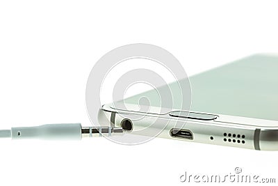 Macro Smartphone connect with headsets isolated on white Stock Photo
