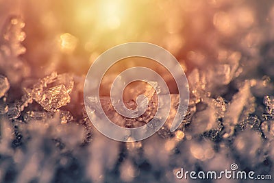 Macro of snow, frost with yellow and orange gradient Stock Photo