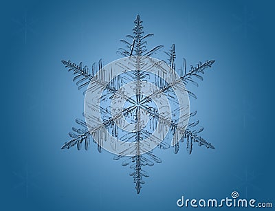 Macro snowflake on blue Stock Photo