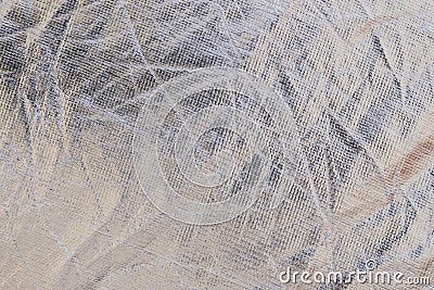 Macro of the texture of a metallic wrinkled plastic fabric, background for industrial futuristic designs Stock Photo