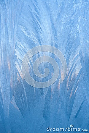 Macro vertical blue winter frosty pattern similar as feathers or leaves. Stock Photo