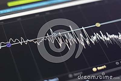 a macro view of the computer monitor screen with sound audio wave graph volume Stock Photo