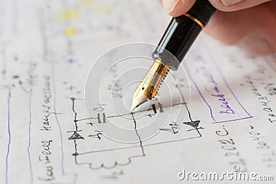 macro view of engineer planing the electrical circuit on papers Stock Photo