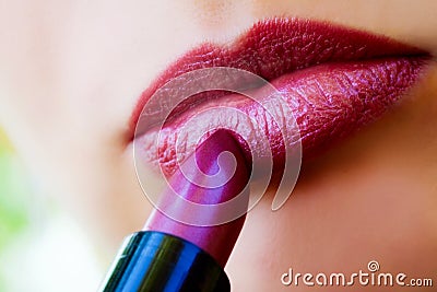 Macro view of female lips and red lipstick Stock Photo