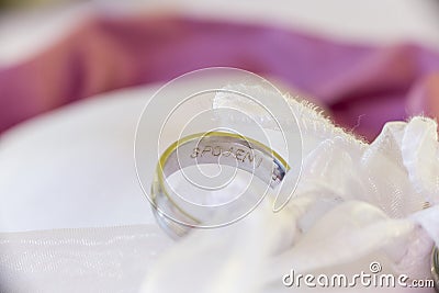 Macro wedding ring on pillow Stock Photo