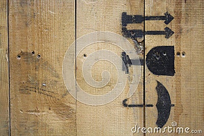 Macro wood texture spray painted with black fragile icons Stock Photo