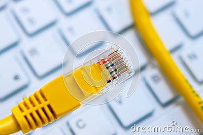 Macro of a yellow network cable Stock Photo