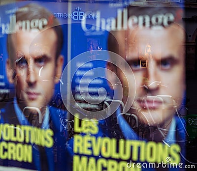 Macron revolution poster with city reflection Editorial Stock Photo