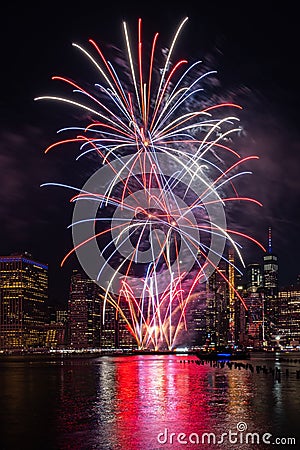 Macy`s 4th of July Independence Day Fireworks show on east river with Lower Manhattan Skyline Editorial Stock Photo