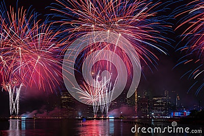Macy`s 4th of July Independence Day Fireworks show on east river with Lower Manhattan Skyline Editorial Stock Photo