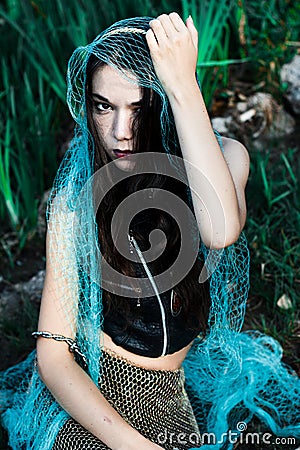 Mad mermaid got caught in the net Stock Photo