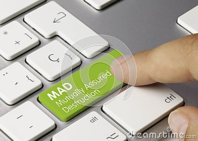 MAD Mutually assured destruction - Inscription on Green Keyboard Key Stock Photo